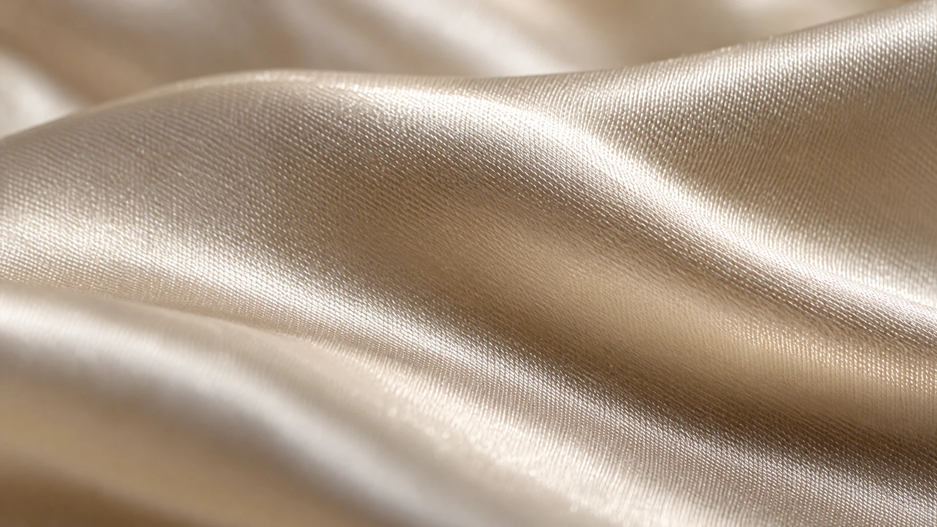 Macro detail of the silk charmeuse weave showing the fine diagonal structure.